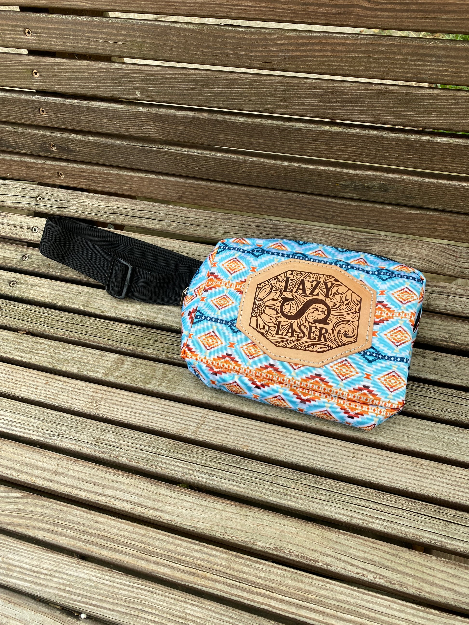blue orange teal southwest print sling bag with floral embossed laser engraved leather patch