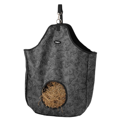 Gray faux leather tooled patterned hay bag with Tough 1 branding and hay inside.