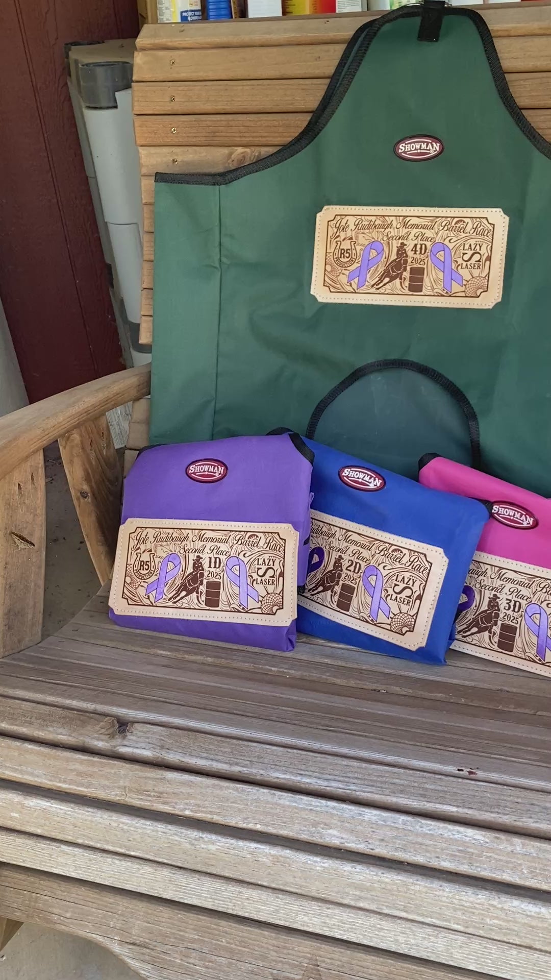 Video of award hay bags displayed on a rustic wooden rocking chair with a butterfly landing beside the bags and flapping its wings