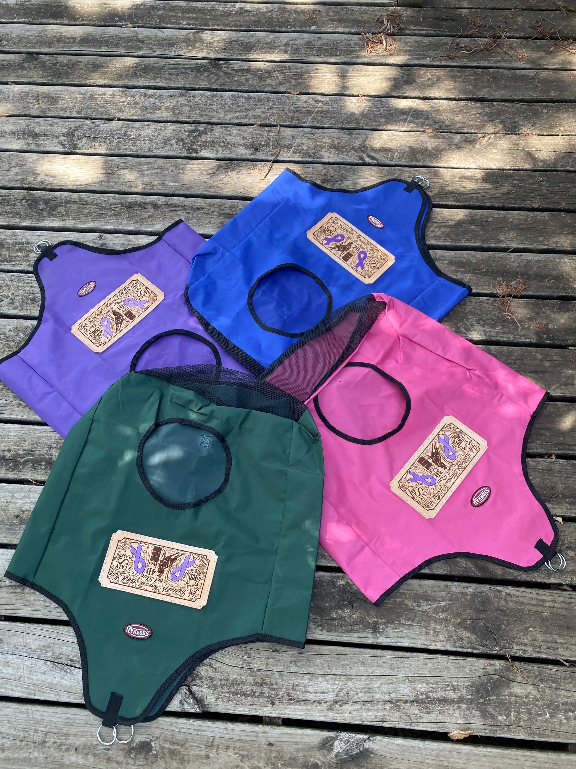 Set of 4 personalized hay bag awards with laser engraved logos for a barrel race