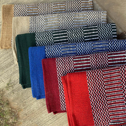 Color choices for navajo pattern saddle blankets color displayed neatly on a concrete backdrop.